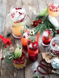 Holiday Drinks with Red and Green fruit and greenery