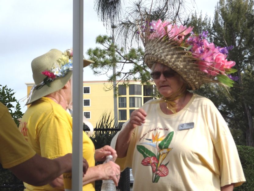 March in the Park 2022 garden club of cape coral garden club members with flowered hats