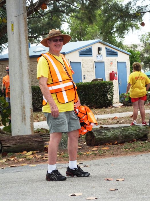 March in the Park 2022 garden club of cape coral member directing traffic