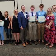 Merit scholarship winners and families