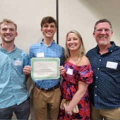 Merit scholarship winner and family