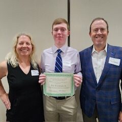 Merit scholarship winner and family