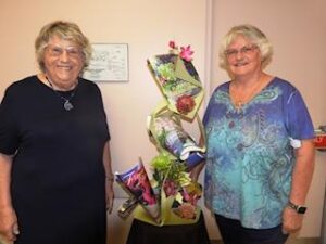 Flower show chairs, Kathy Woodlock and Sylvia Swartz with a winning flower arrangement